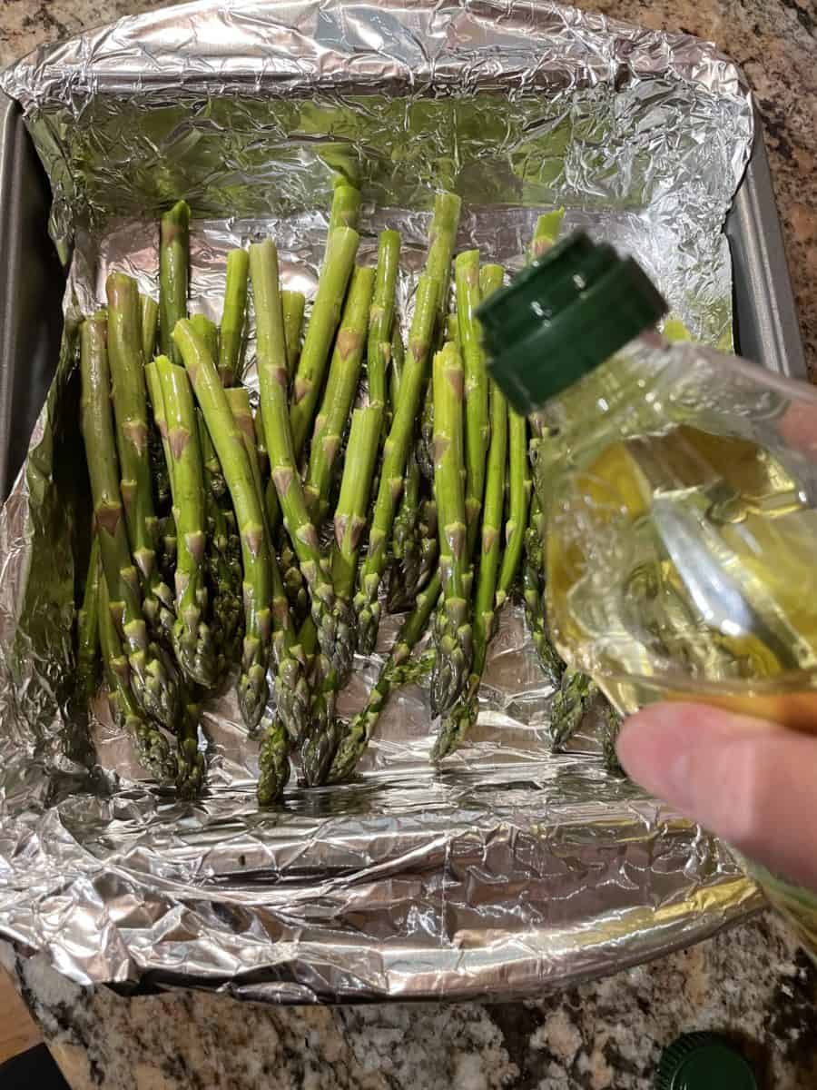 Drizzle the Asparagus with Olive Oil.