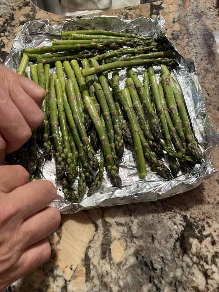Creating a foil boat to put the asparagus into.