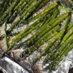 Smoked Asparagus on a piece of foil on a pellet grill.