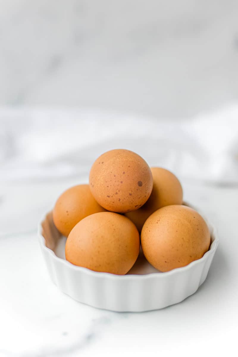 A small bowl of farm fresh brown eggs.