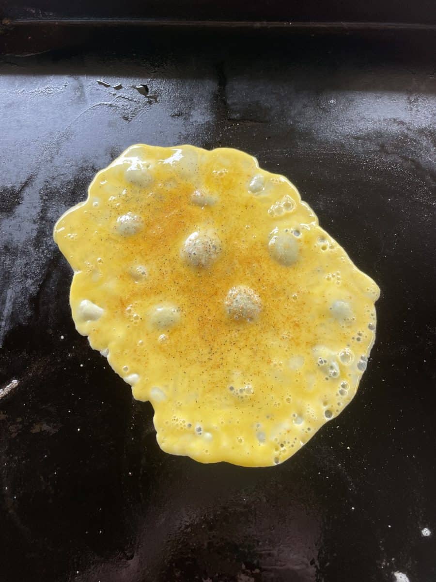 Seasoned Scrambled Eggs cooking on a Blackstone Griddle.