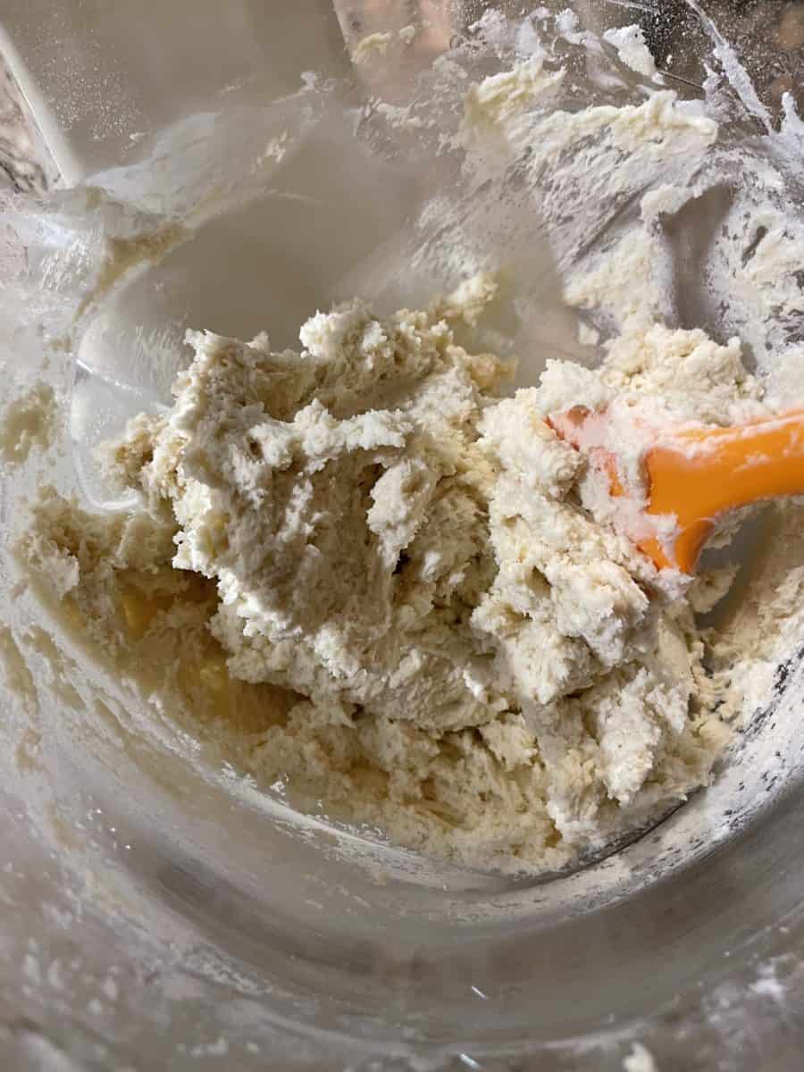 Spritz Cookie Dough in a Mixing Bowl with a Silicone Spatula.