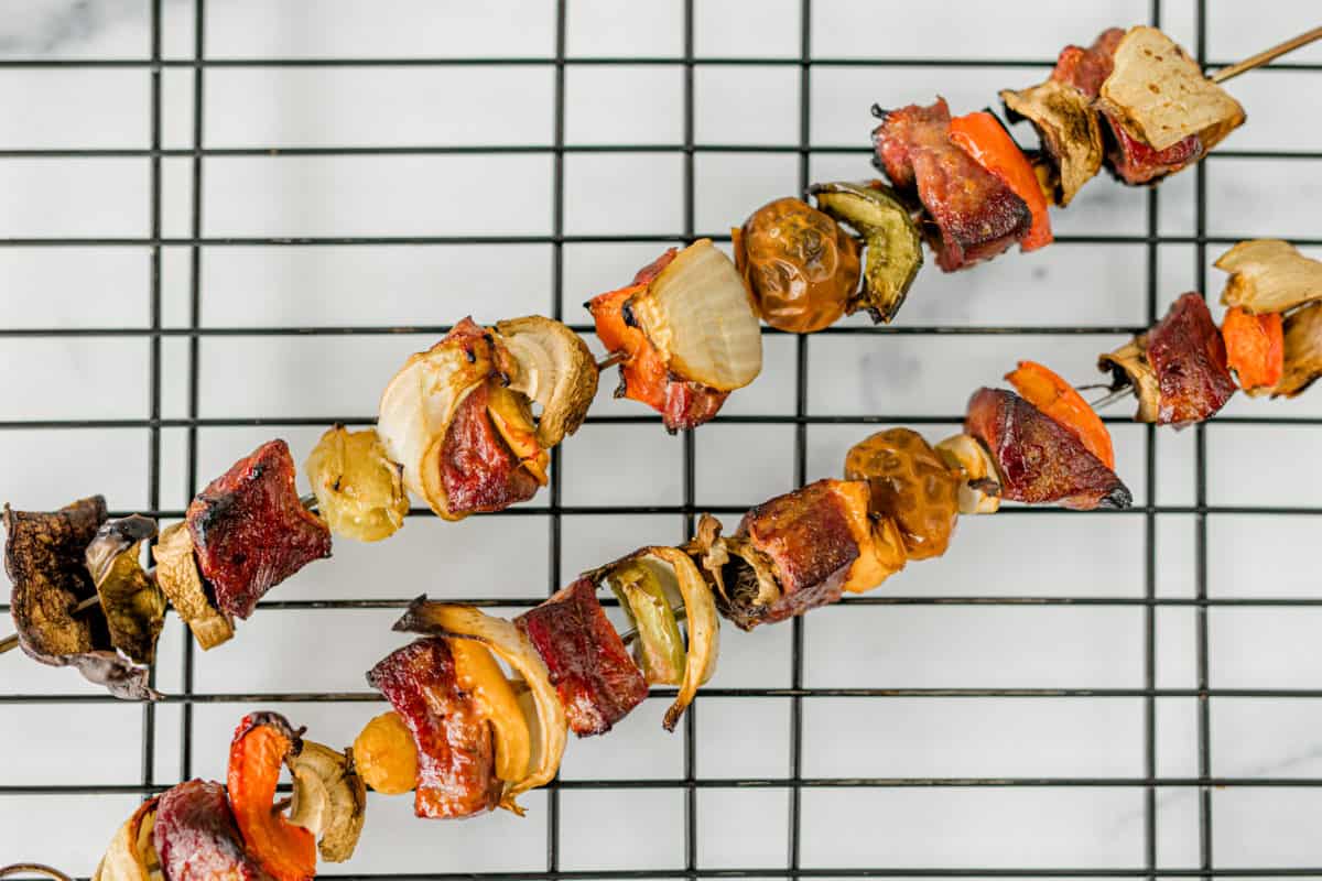 Venison Kabobs Smoked on a Pellet Grill, resting on a wire rack.