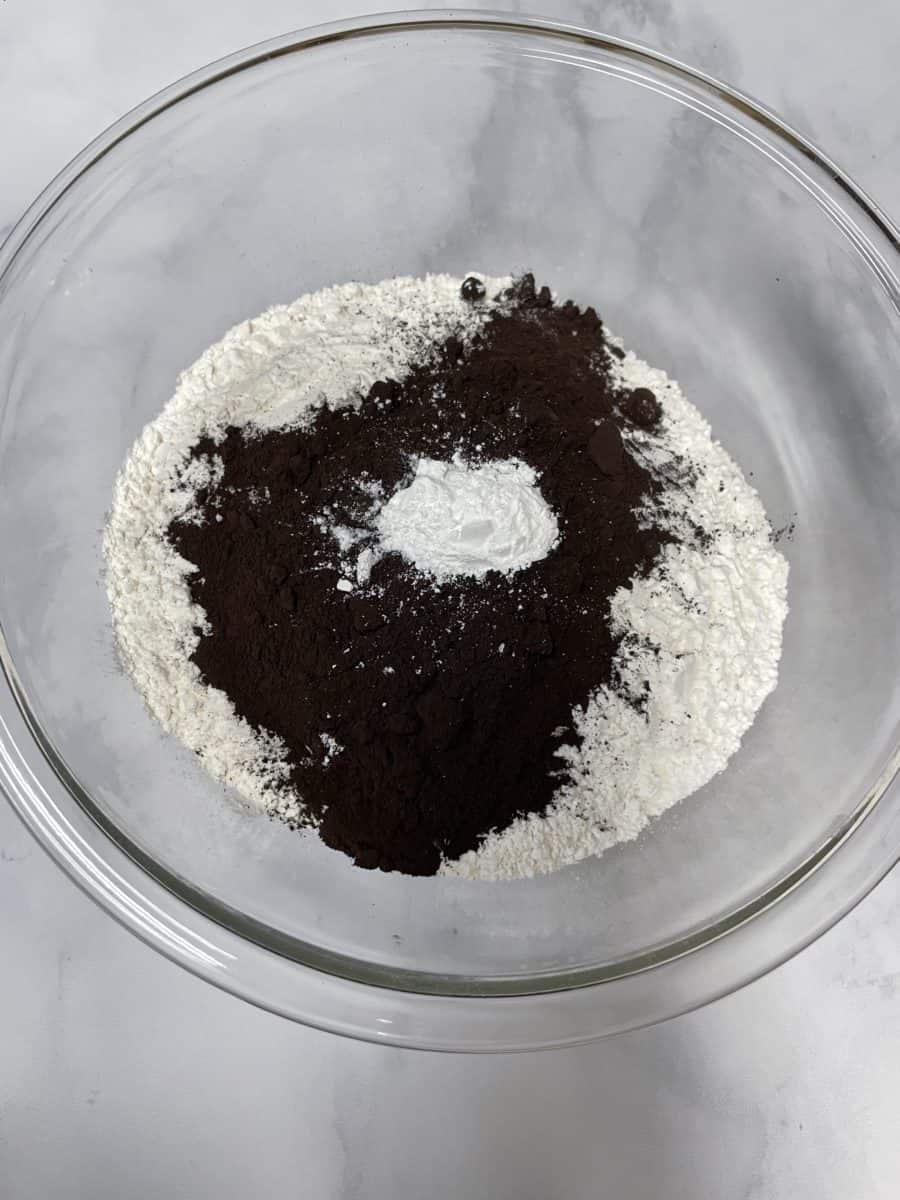 In a bowl, add the flour, black cocoa, baking soda, and baking powder.