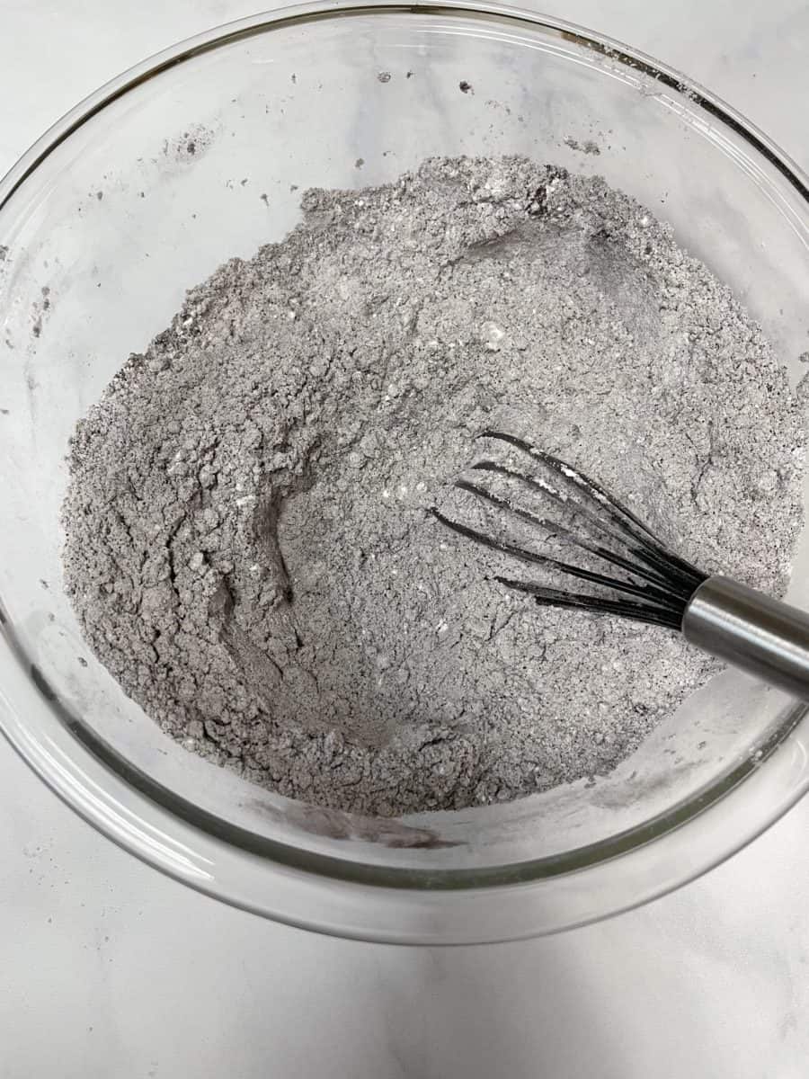 With a whisk, combine the dry ingredients: the flour, black cocoa, baking soda, and baking powder.