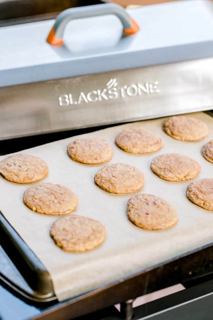Blackstone Small Batch Cookies - On a sheet pan with a dome lid on the side.