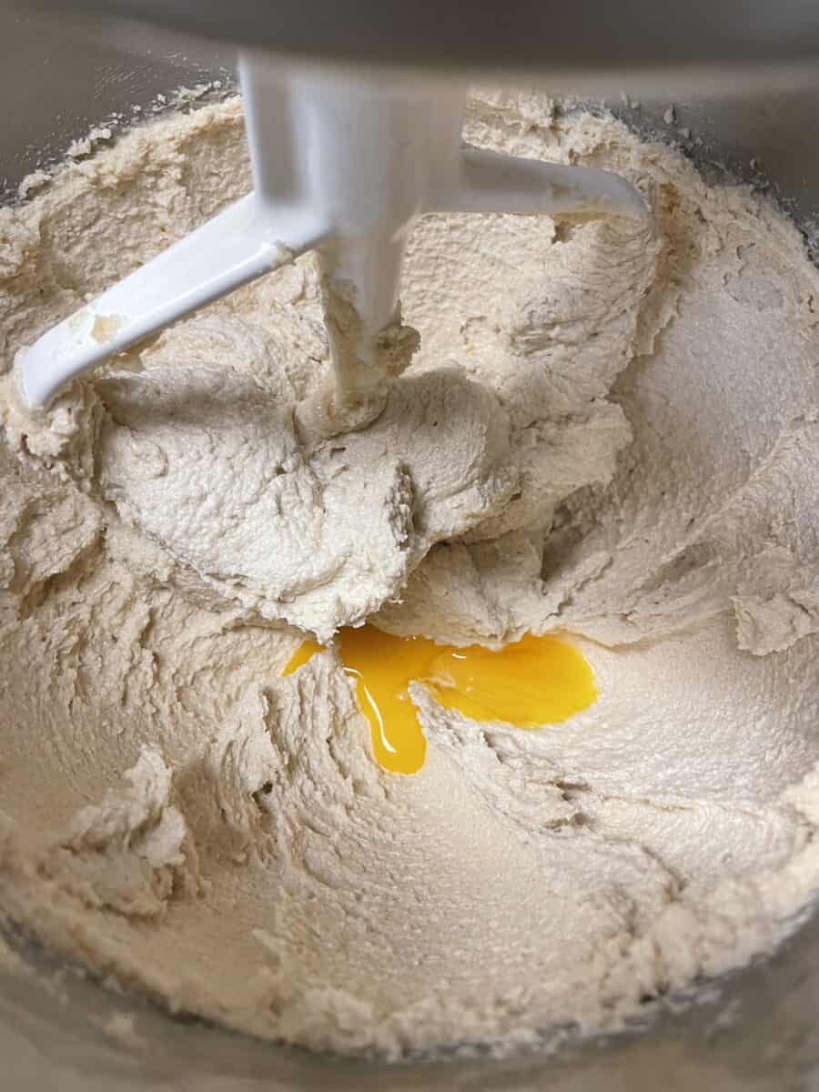 Add egg yolk and vanilla to the butter/sugar mixture in a mixing bowl.