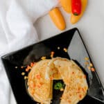 Veggy Pancakes on a plate with sweet peppers on the side.