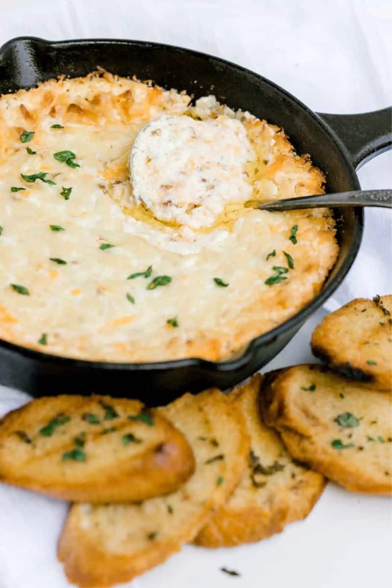 Smoked Crack Dip in a Cast Iron Pan with a side of Smoked Baguettes.