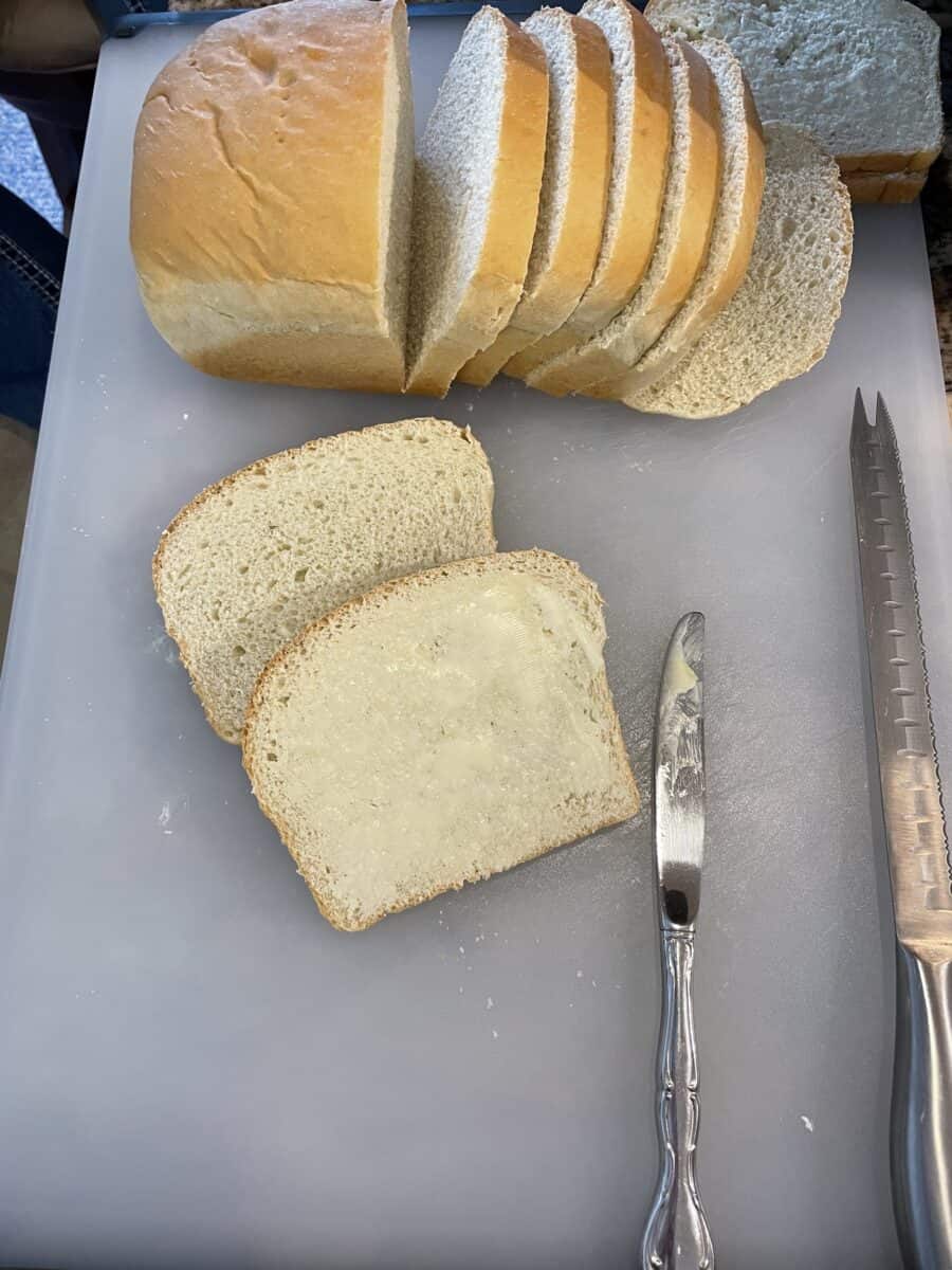 Sliced White Bread and also buttering the bread.