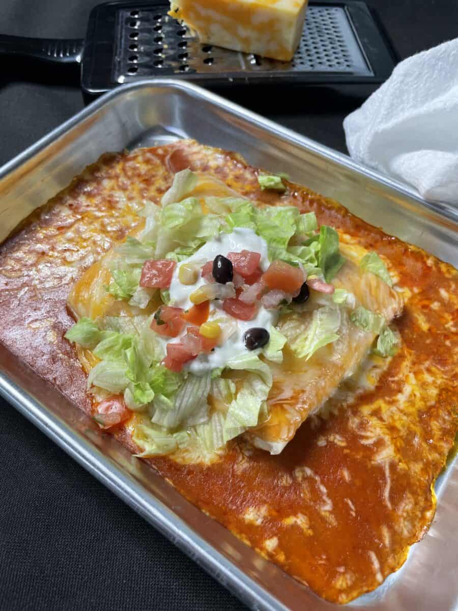 Fully assembled Wet Burrito with Pulled Pork on a small serving pan.