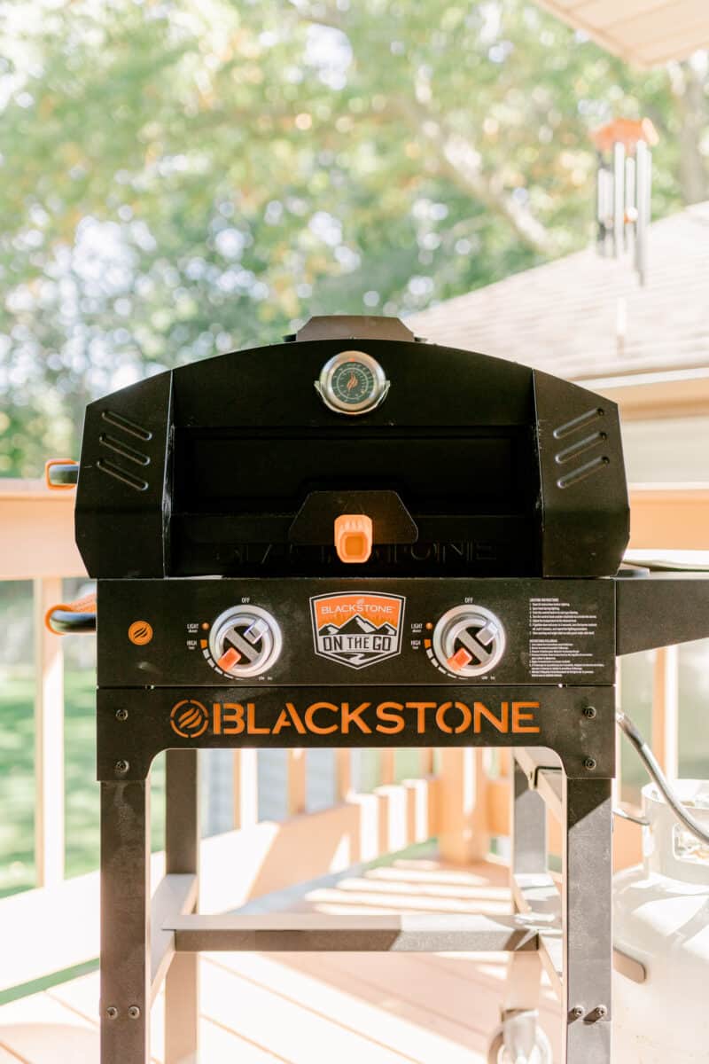 Blackstone Pizza Oven Attachment on top of a Blackstone 22 inch Griddle Burner with cart.