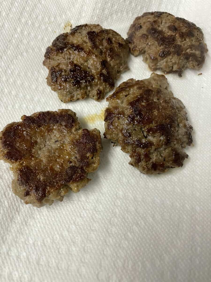 Letting Sausage Patties Cool on a Paper Towel Lined Plate.