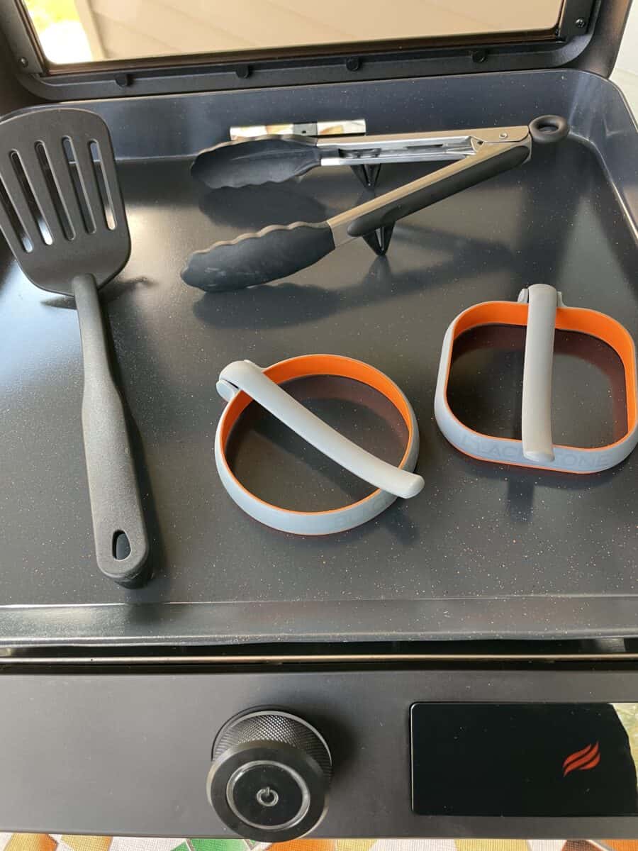Blackstone Electric Griddle with Silicone Egg Rings, Plastic Spatula, and Silicone Coated Tongs.