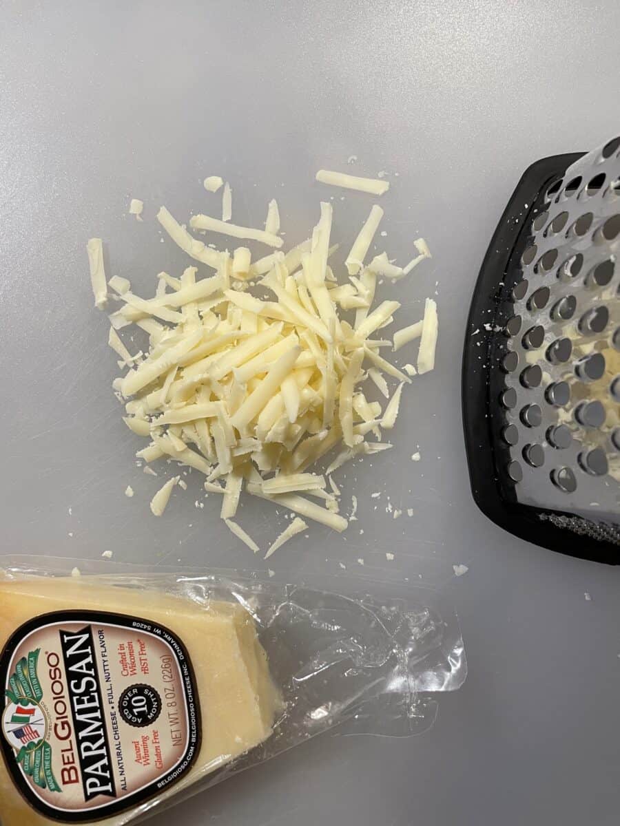 Shredding the Parmesan Cheese with a Box Grater.