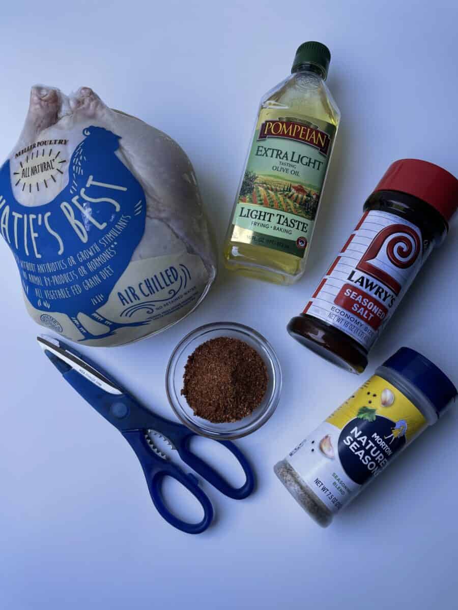 Smoked Chicken Ingredients: Whole Chicken, Olive Oil, BBQ Dry Rub, Lawry's Seasoned Salt, Morton Natures Seasoning, and Kitchen Shears.