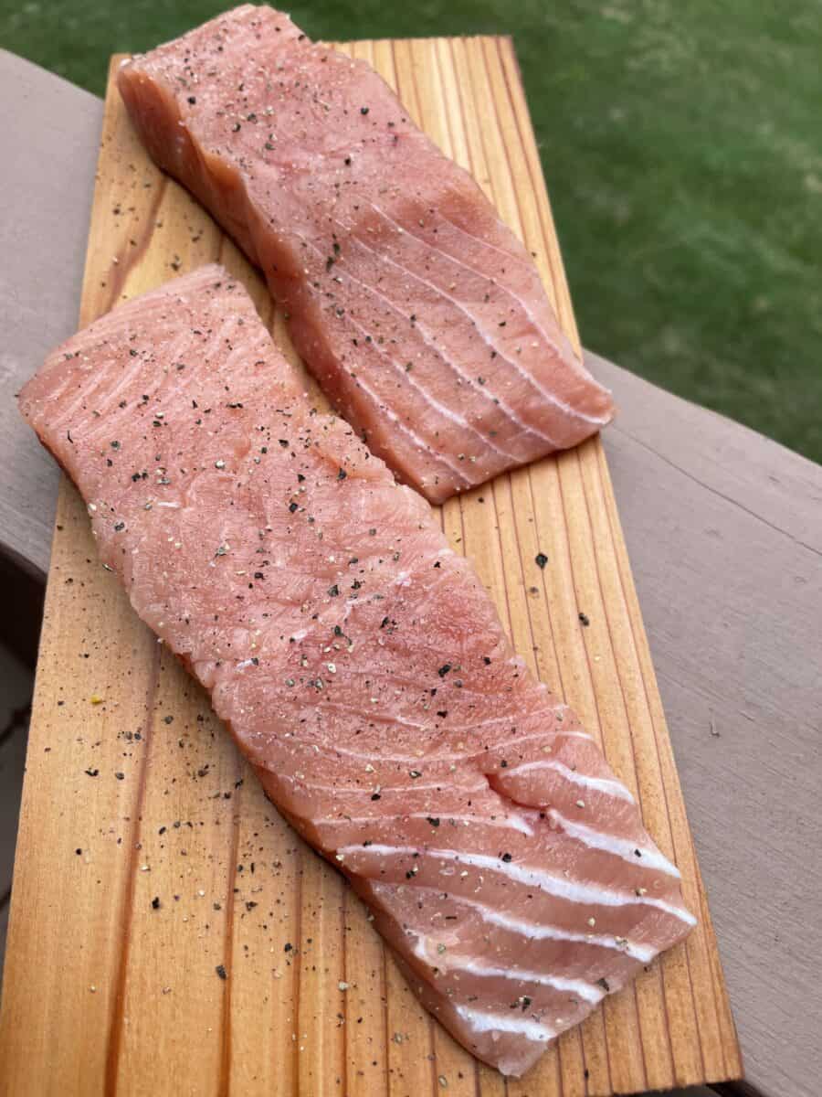 Salt and Pepper on Salmon Fillets on Cedar Plank.