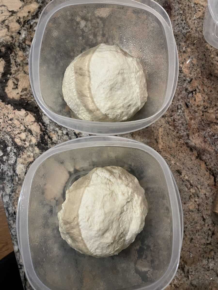 Divide Pizza Dough in Half and Place into Greased Bowls.