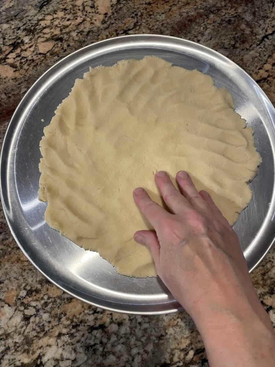 With Your Fingertips, Press the Cookie Dough Out to Cover the Top of the Pizza Pan.