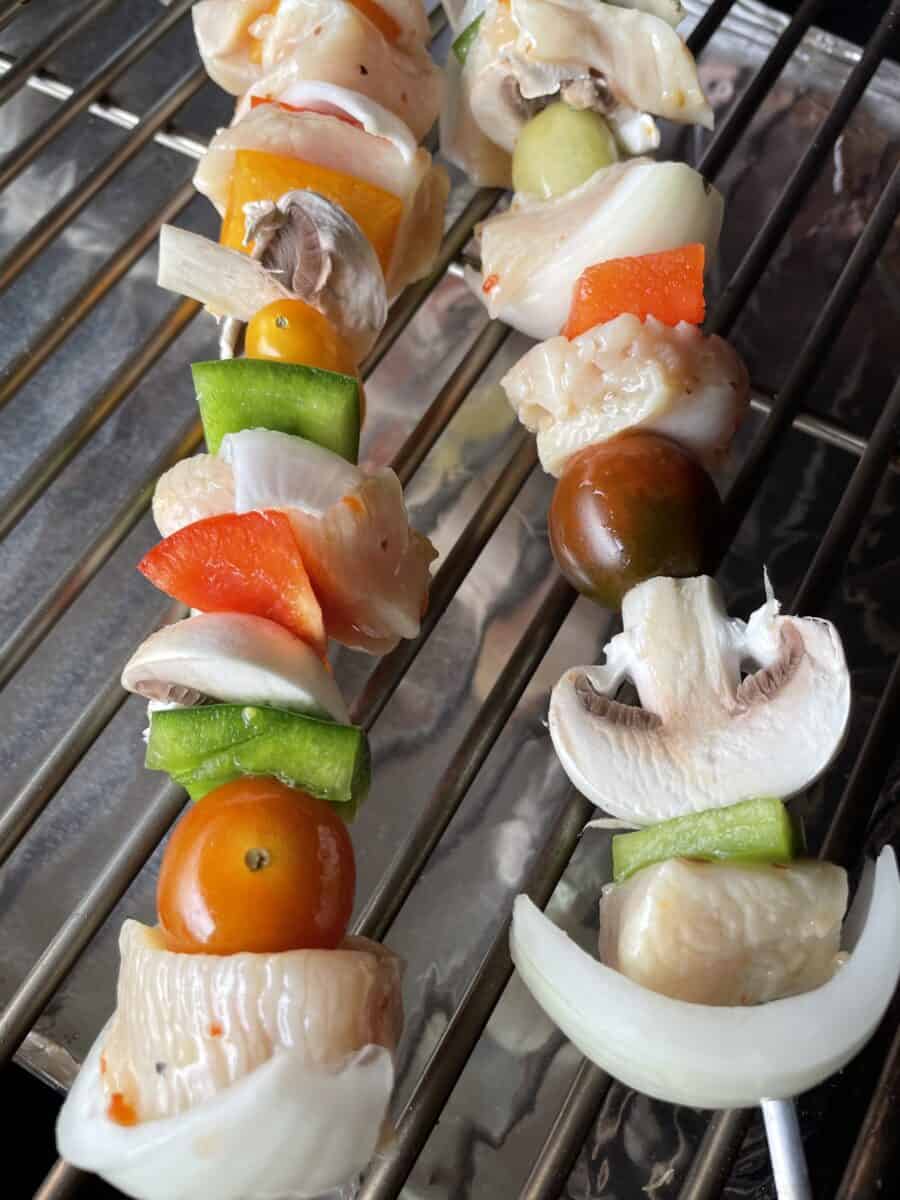 Uncooked Chicken and Vegetable Kabobs on a Pellet Smoker Grill.