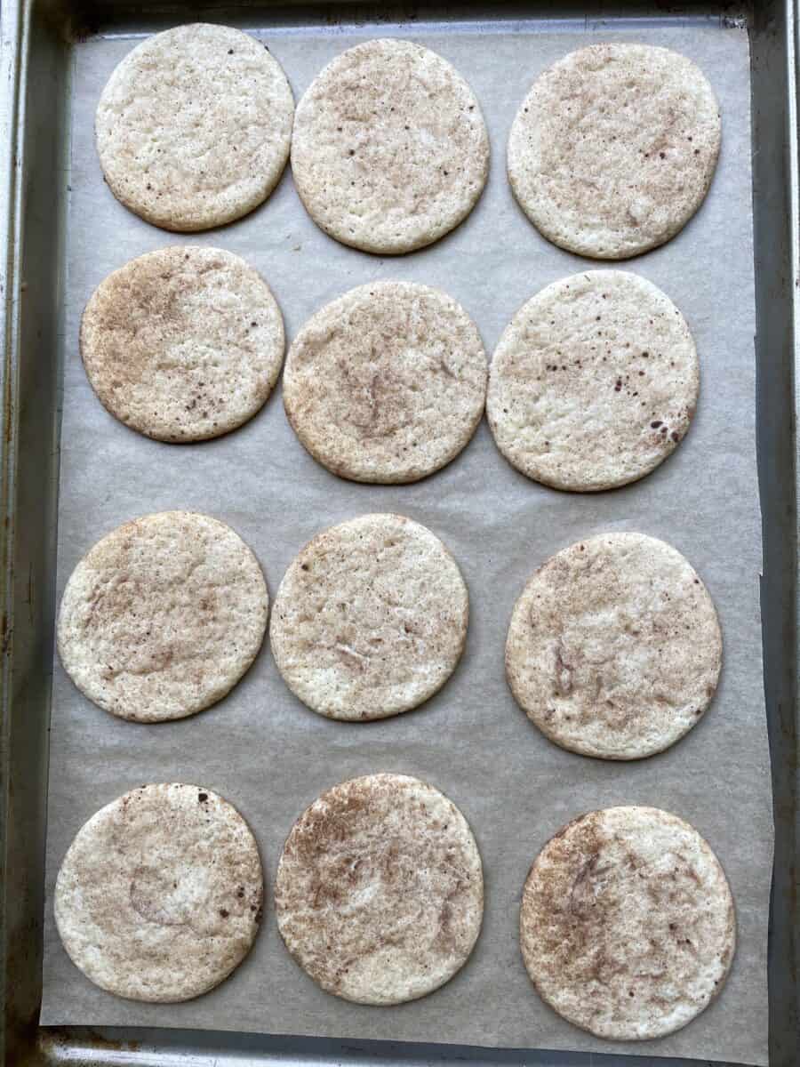 Freshly Baked Snickerdoodle Cookies on a baking sheet pan.