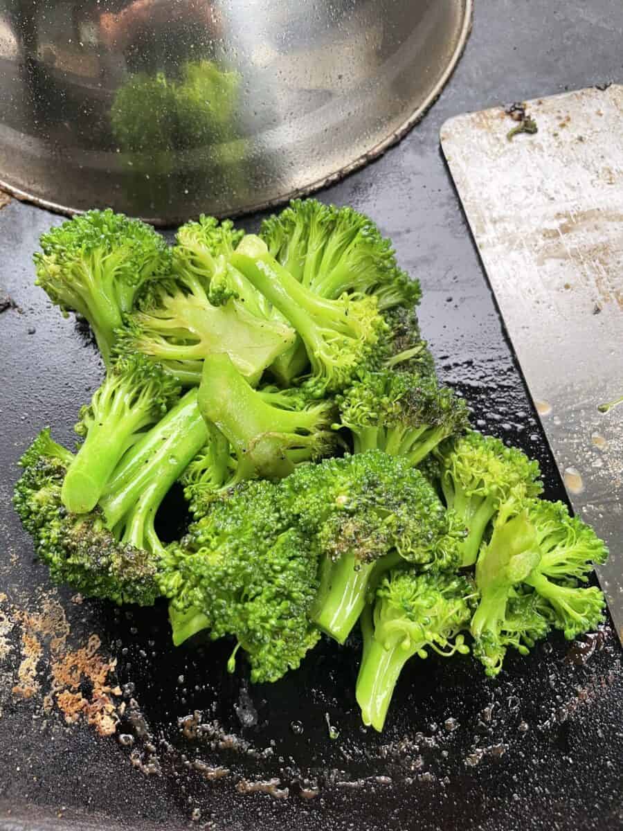 Use a Dome Lid to Steam the Broccoli Pieces on a Blackstone Griddle.
