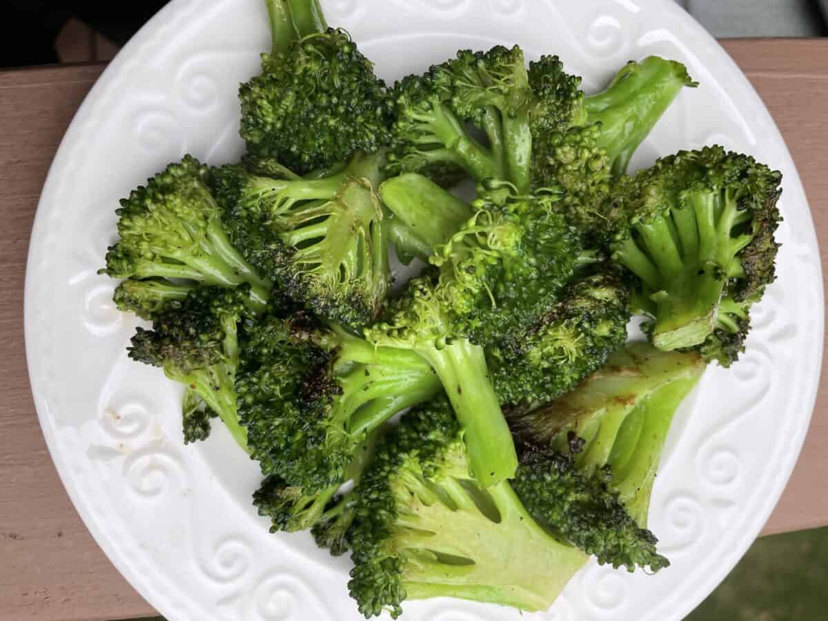 Sauteed Broccoli on a White Serving Plate.