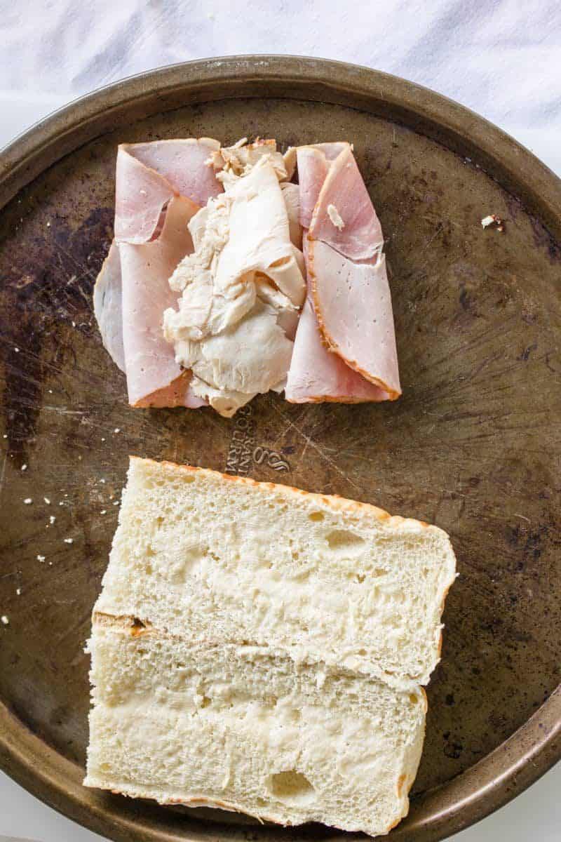 Open Faced Bun along with Layers of Deli Ham and Turkey.