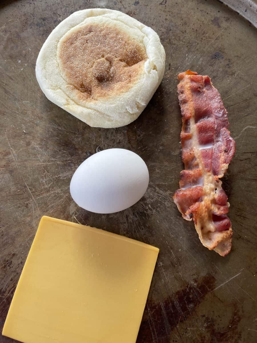 Bacon and Egg McMuffin Ingredients: Bacon Strip, English Muffin, 1 egg, and a slice of American Cheese. 