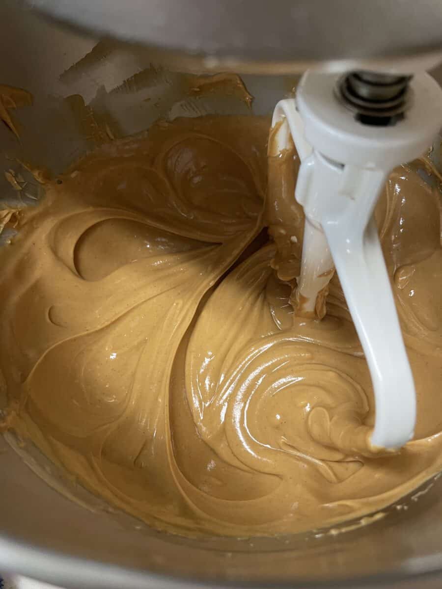 Creamy Peanut Butter and Butter Mixture in a mixing bowl with a flat paddle.