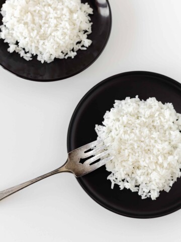 Long Grain White Rice on plates with a fork.