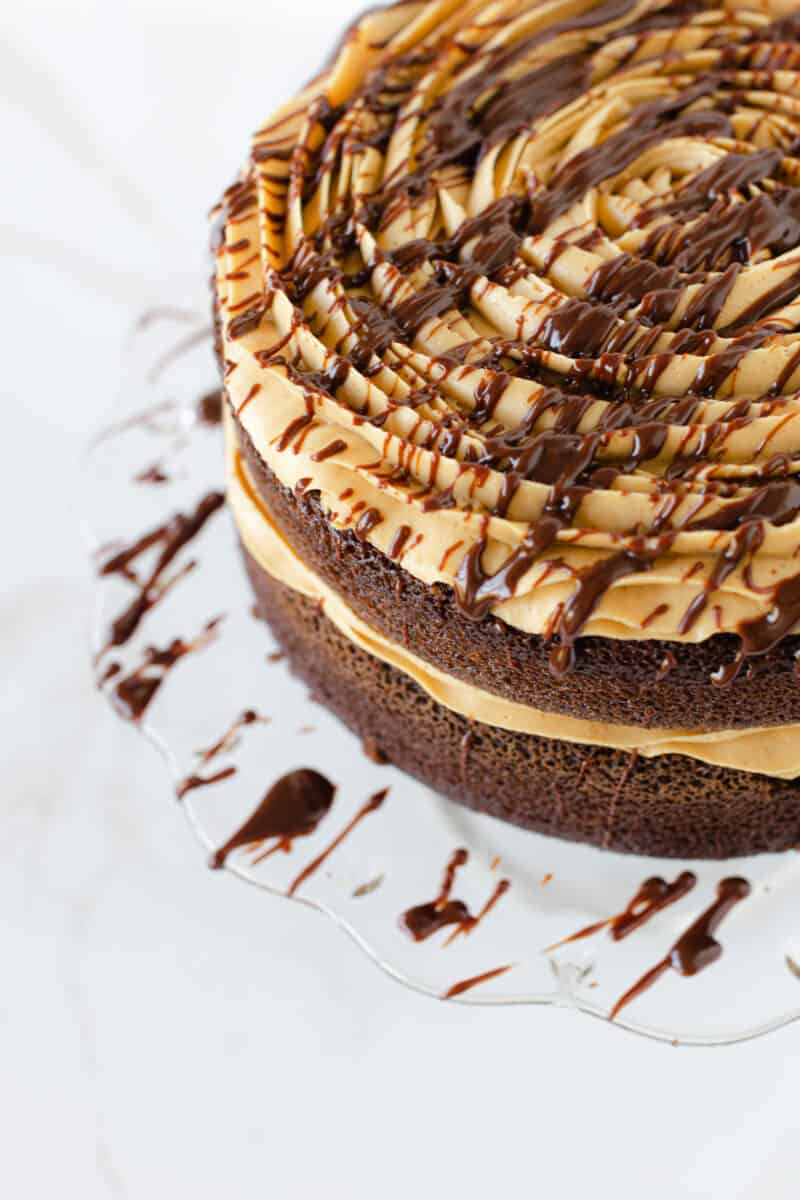 Peanut Butter Frosting for Chocolate Cake Drizzled with Chocolate Ganache.
