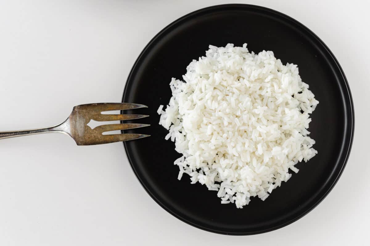 Non-Sticky White Rice on a plate with a fork.