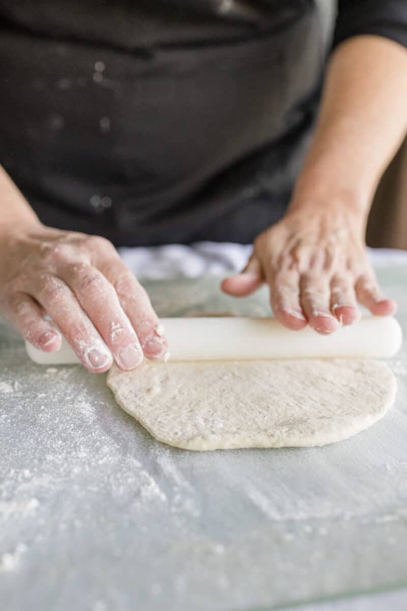 Using a Rolling Pin to Roll Out a Thin Pizza Crust.