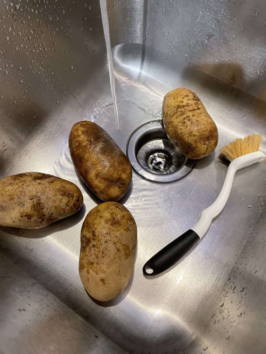 Clean the Outside of Each Potato using a scrub brush and running cold water.  