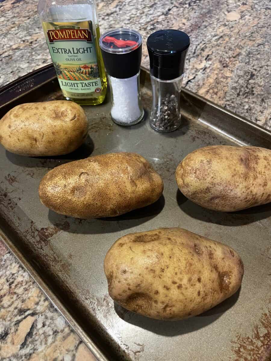Baked Potato ingredients: Large Russet Potatoes, Olive Oil, Salt, and Pepper. 