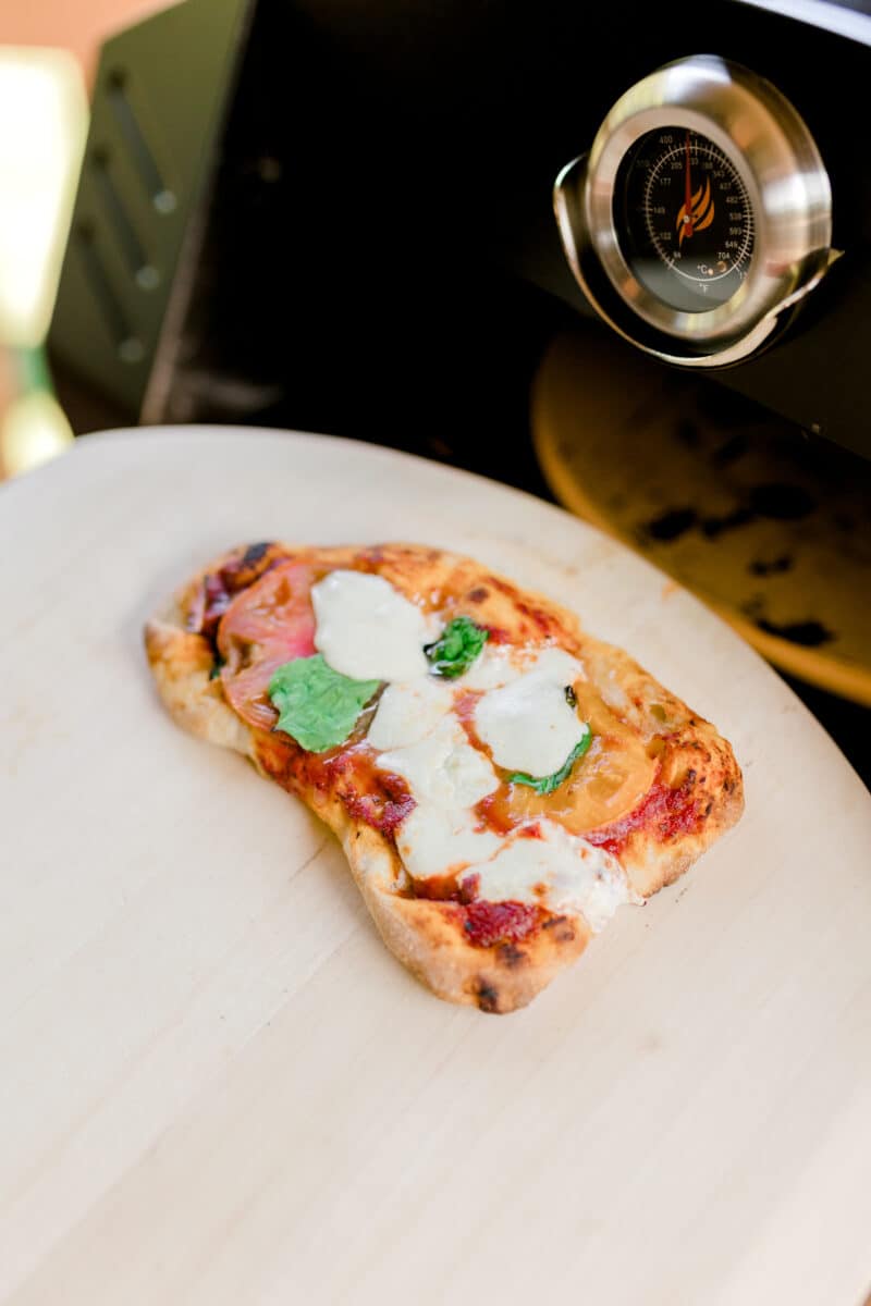Baked Margherita Pizza Coming Out of a Blackstone Pizza Oven.