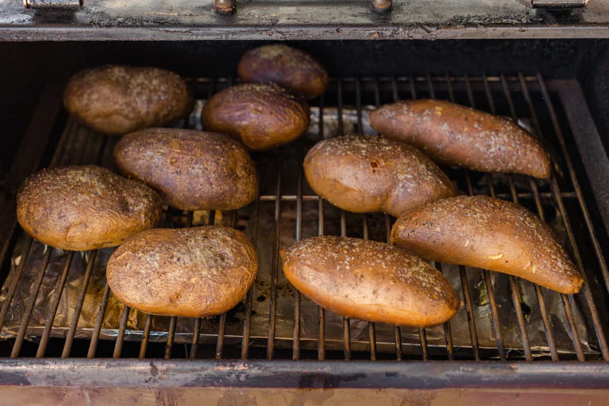 Smoked Baked Potatoes along with Smoked Sweet Potatoes on a Pellet Grill. 