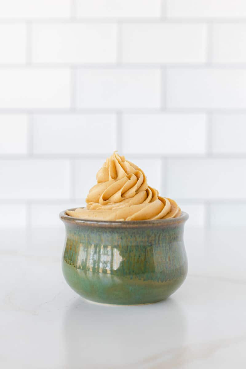 Creamy Peanut Butter Frosting Recipe in a small bowl.