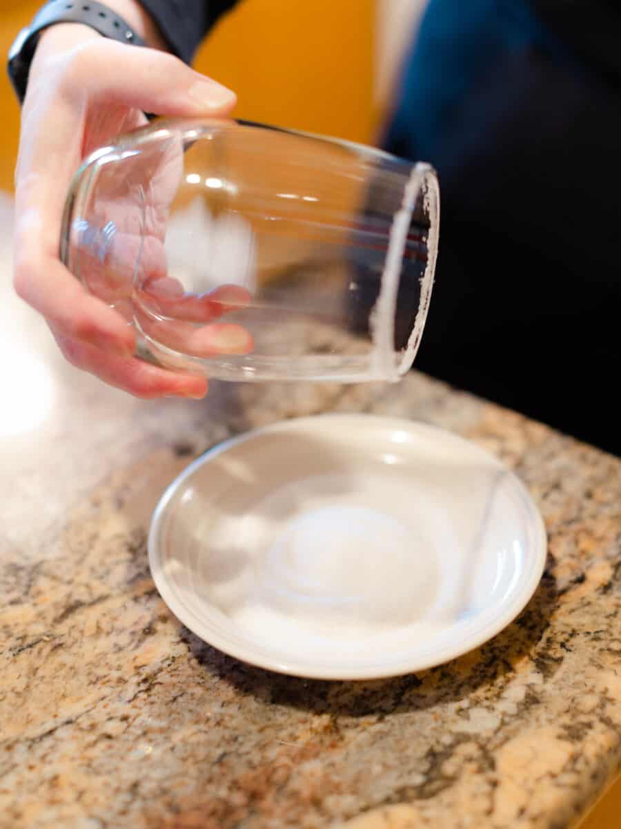 A Sugared Glass Rim Along with a Small Plate of Granulated Sugar.