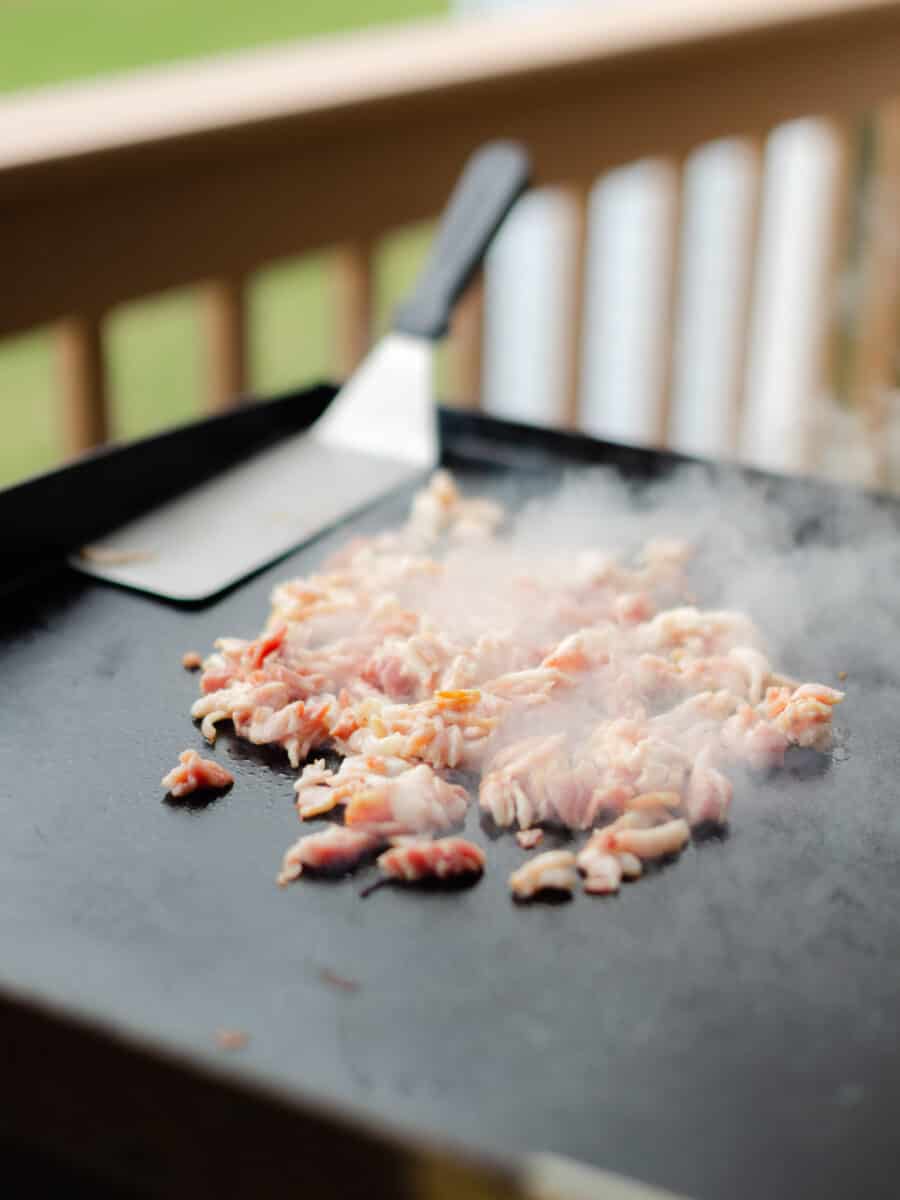 Cooking Bacon Pieces on a Blackstone Griddle.
