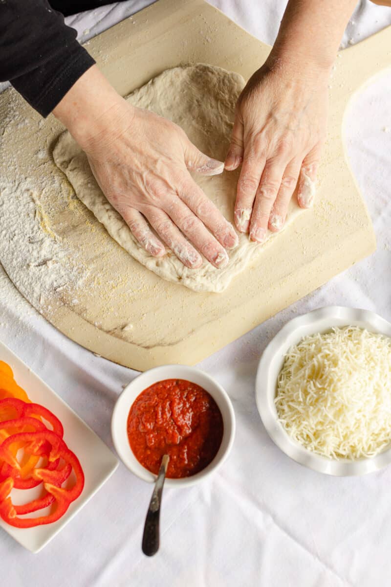 Press Out the Pizza Dough with Fingertips.