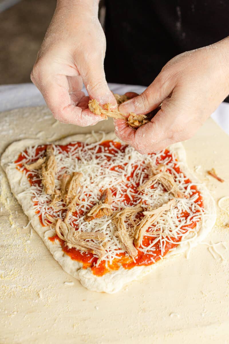 Top the Pizza with Shredded Pulled Pork.