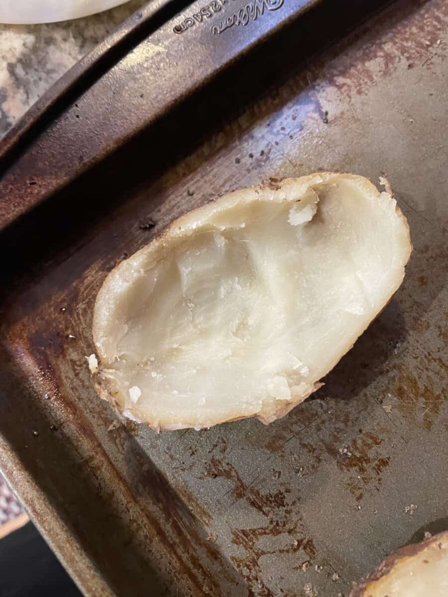 The Half Shell of a Baked Potato on a baking sheet pan.