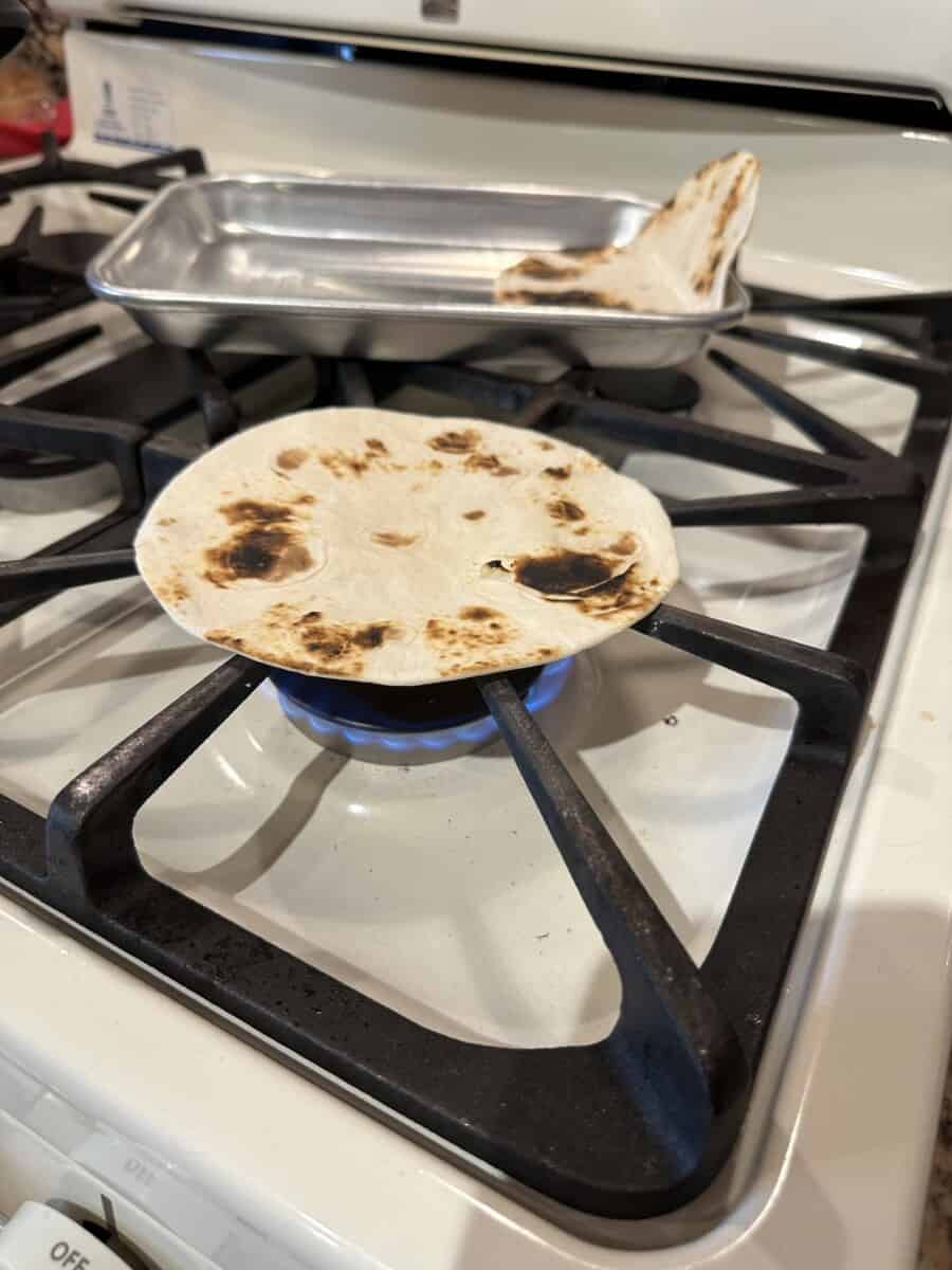 A Toasted Soft Shell Tortilla on a Stove Burner