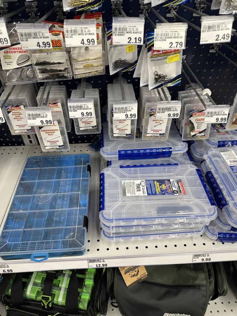 Several Tackle Boxes on a Grocery Store Shelf.