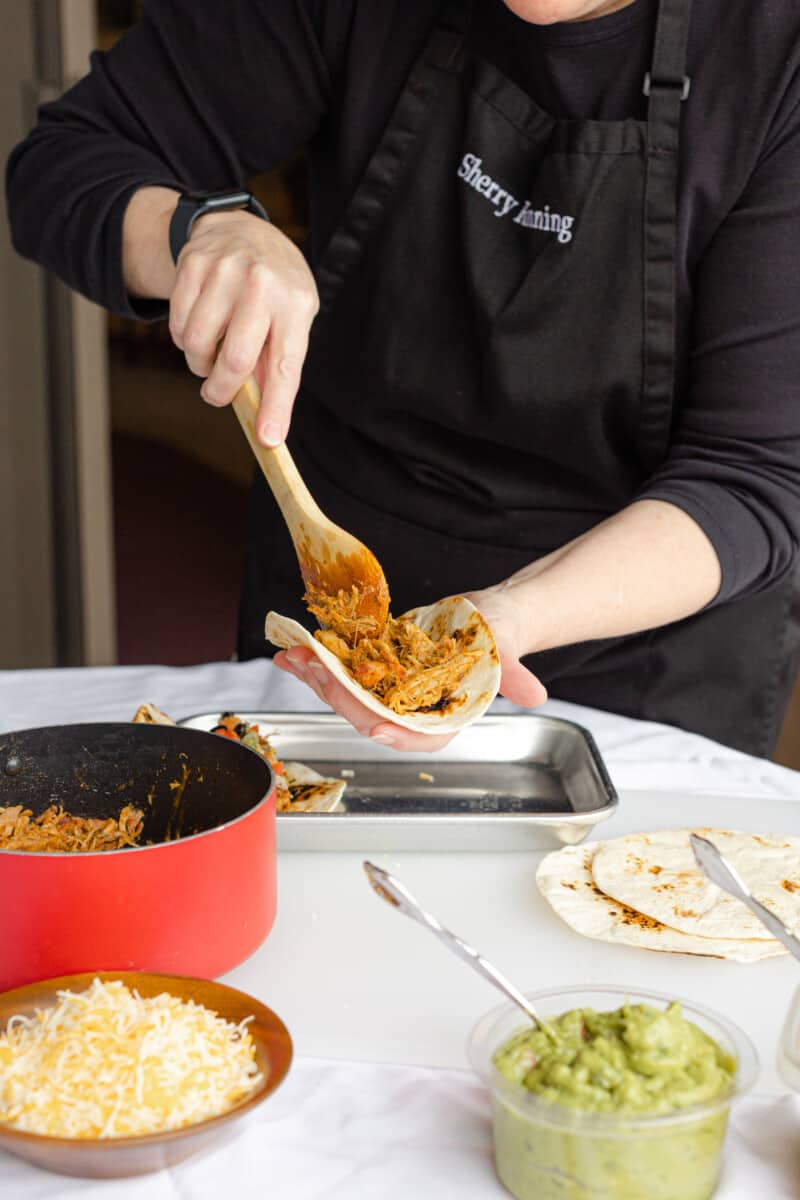 Filling a Soft Tortilla Shell with Taco Pulled Pork