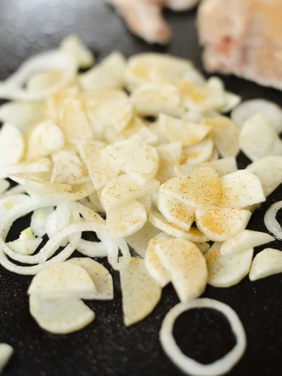 Griddle Cooking Sliced Potatoes and Onions