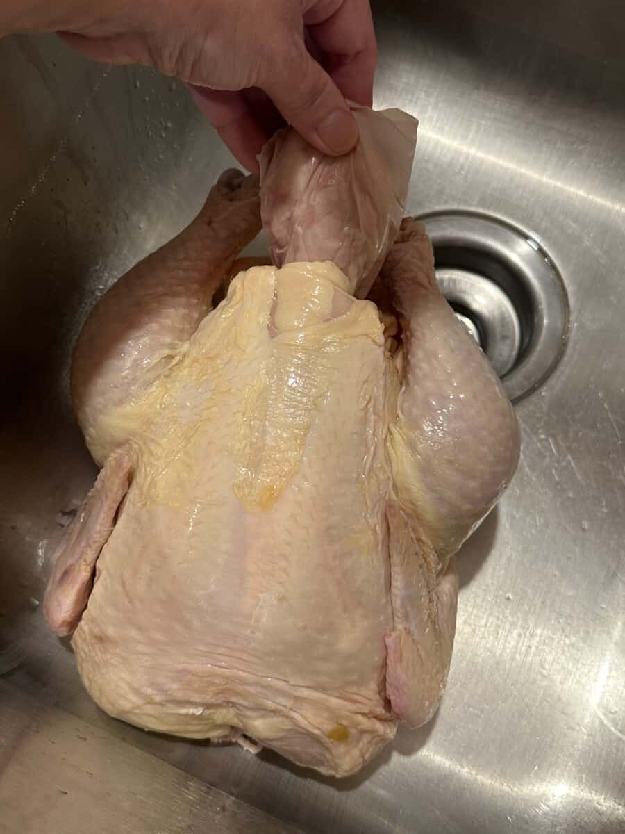 Remove the Giblet Bag from inside the Chicken.
