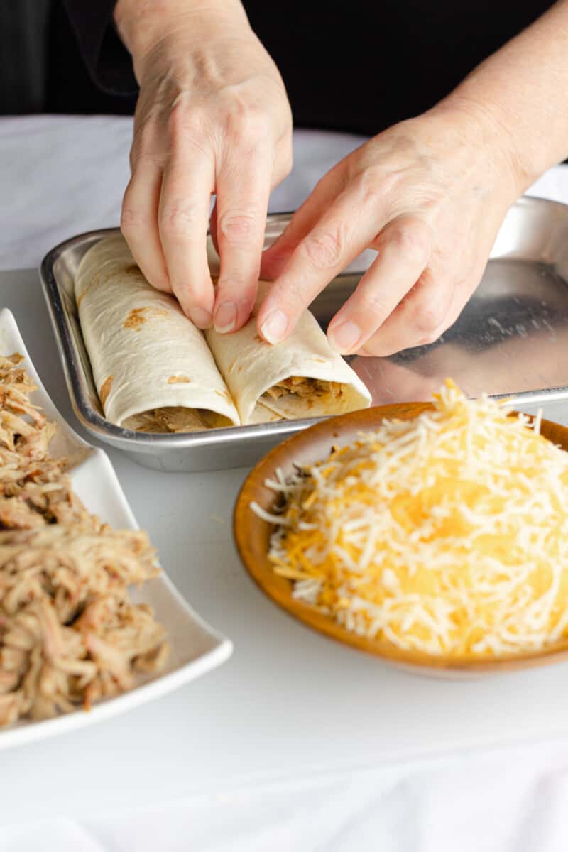 Lining the Folded Enchiladas in a Baking Pan.